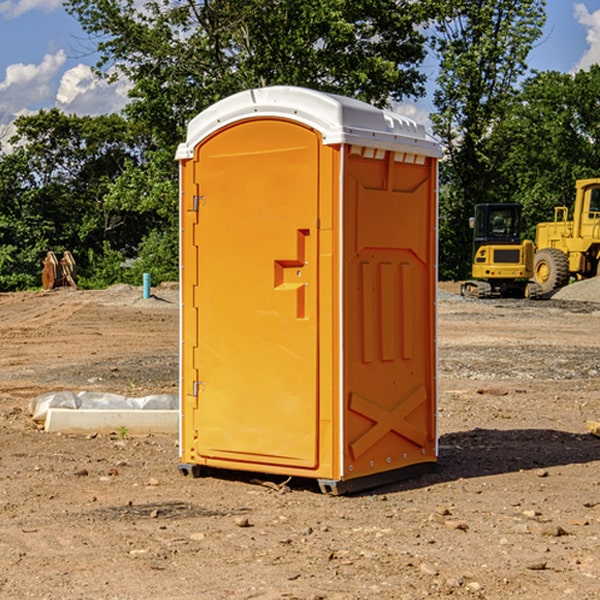 what is the cost difference between standard and deluxe portable toilet rentals in Adams County IA